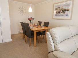 A dining room with a table and chairs at Golva in Carbis Bay