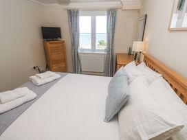 A bedroom with a bed and window at Golva in Carbis Bay