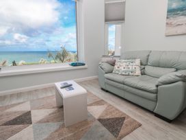 A living room with a view of the sea at Island View in Carbis Bay