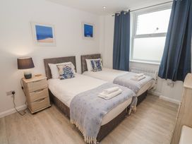 A bedroom with two beds in Island View at Carbis Bay