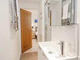 A bathroom with a sink and mirror at Island View in Carbis Bay