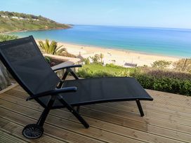 A deck chair overlooking the beach at Sapphire in Carbis Bay