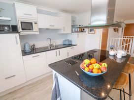 A kitchen with a fruit bowl and appliances at Sea Breeze in Carbis Bay
