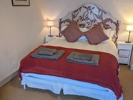 A bedroom with a bed and nightstand at The Ferry House Ramelton, County Donegal