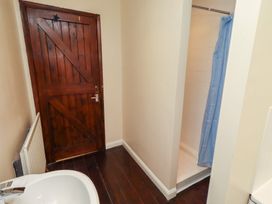 A bathroom with a shower and sink at ASTA COTTAGE in Cresswell