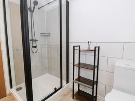 A bathroom with a shower and a toilet at Merddwr in Cerrigydrudion