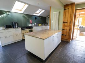 A kitchen with a large island countertop and skylights at Fron Goch Farm in Llanfair Talhaiarn