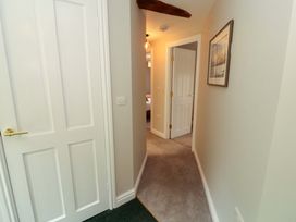 A hallway with doors leading to other rooms at Swallow's Nest Thornthwaite near Braithwaite