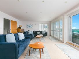 A living room with sofas and a coffee table at Sandbanks in Praa Sands