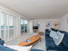 A living room with a sofa and coffee table at Sandbanks in Praa Sands