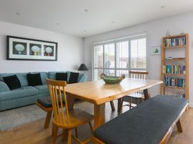 A dining room with a table and chairs at Sandbanks, Praa Sands