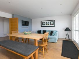 A dining room with a table and chairs at Sandbanks in Praa Sands