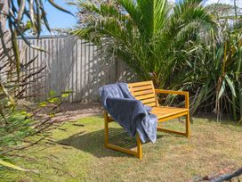 A bench with a blanket in a garden at Sandbanks, Praa Sands