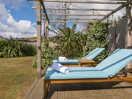 A garden with loungers and towels at Sandbanks in Praa Sands