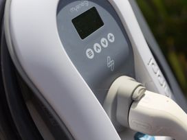 A charging station with a screen and power plug at Sandbanks in Praa Sands