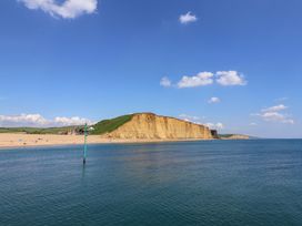 A view of a cliff alongside the sea at West Bay Holiday Home in West Bay