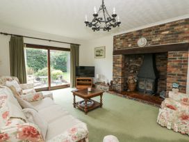 A living room with a television and fireplace at Kala Spittal near Haverfordwest