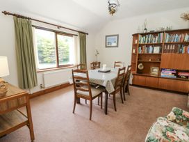 A dining room with a table and chairs at Kala in Spittal near Haverfordwest