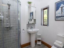 A bathroom with a shower, sink, and toilet at Kala Spittal near Haverfordwest