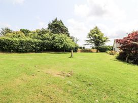 A garden with trees and grass at Kala in Spittal near Haverfordwest