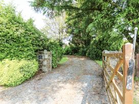A gravel path with a gate and stone wall at Kala in Spittal near Haverfordwest