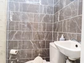 A bathroom with a shower and sink at Tyddyn Elidir near Old Colwyn