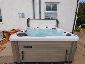 A hot tub in an outdoor area at Tyddyn Elidir near Old Colwyn