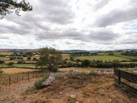 A landscape view with trees and fields near Old Colwyn