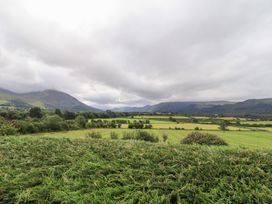 A landscape with mountains and fields at Squirrel Cottage in Bassenthwaite
