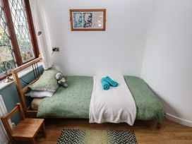 A bedroom with a bed and a toy at Llys-Yr-Onnen in Carmarthen