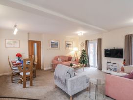 A living room with a sofa and dining table at Weydale Avenue in Scarborough