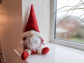 A decorative figure sitting on a windowsill at Weydale Avenue in Scarborough
