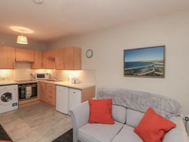 A kitchen with appliances and a sofa at Beck View