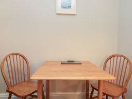 A dining room with a table and two chairs at Beck View 