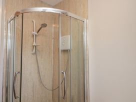 A shower with glass doors and a control panel at Beck View