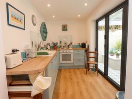 A kitchen with a sink and countertop at Bodefi in Nefyn