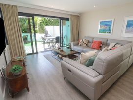A living room with a sofa and coffee table at Peninsula Apartment 2 in St Ives