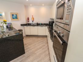 A kitchen with appliances and a countertop at Peninsula Apartment 2 St Ives