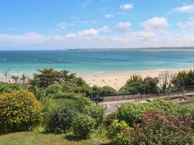 A beach view with sand and boats at Peninsula Apartment 2 in St Ives
