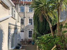 An outdoor area with plants and seating at Monarch Brewers Quay Harbour