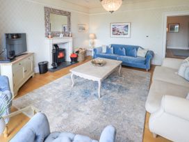 A living room with a television and coffee table at Fern Bank in Penrith