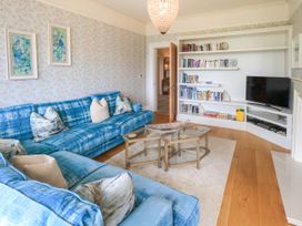 A living room with a sofa and a television at Fern Bank in Penrith