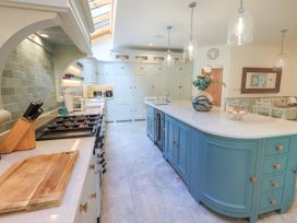 A kitchen with a countertop and cabinets at Fern Bank in Penrith