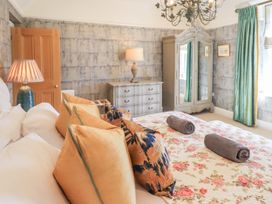 A bedroom with a bed and dresser at Fern Bank in Penrith