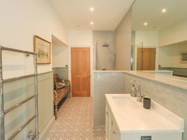 A bathroom with a wash basin and shower at Fern Bank in Penrith