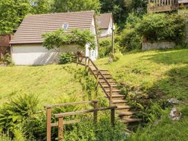 A house with steps leading to a garden at Lavender Lodge in St. Ann's Chapel, Cornwall