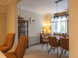 A dining room with a table and chairs at George House in Dartmouth