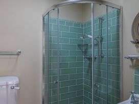 A bathroom with a shower and toilet at George House in Dartmouth