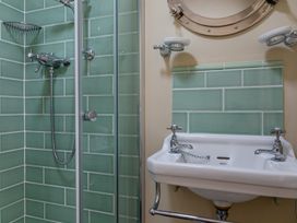 A bathroom with a shower and a sink at George House Dartmouth