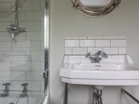 A bathroom with a shower and sink at George House in Dartmouth